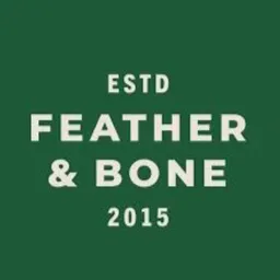 Feather and bone Bar & Grill logo